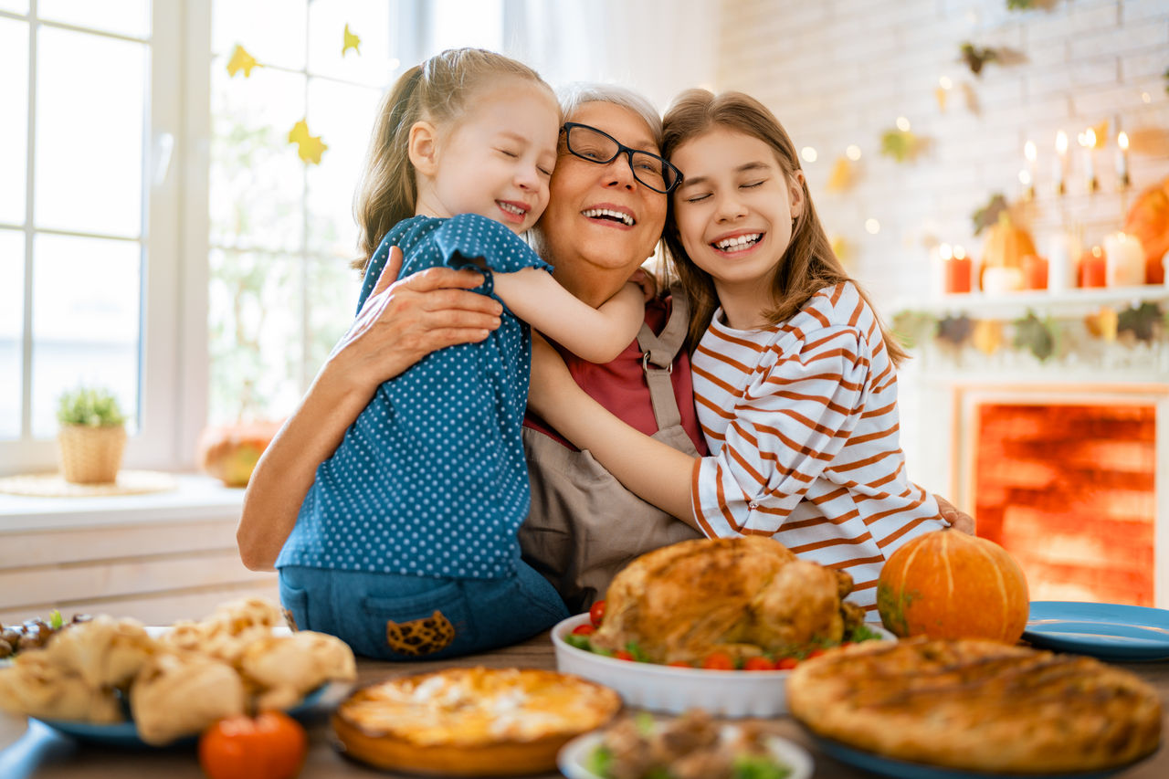 Grandmother and two children cooking together